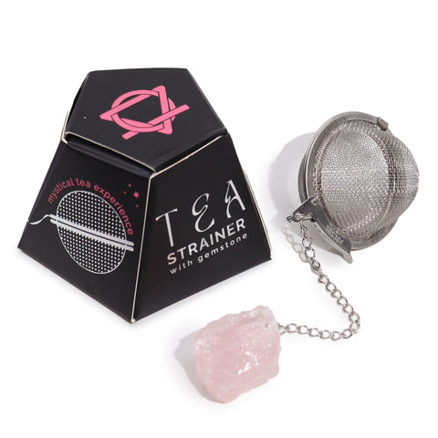 Raw Crystal Gemstone Tea Strainer, Rose Quartz, silver infuser and pink stone beside a black box