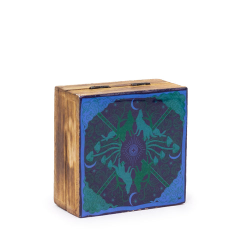 Hop Hare Small Enameled Square Box, Wolf & Moon, closed with a blue and green hare design on the lid