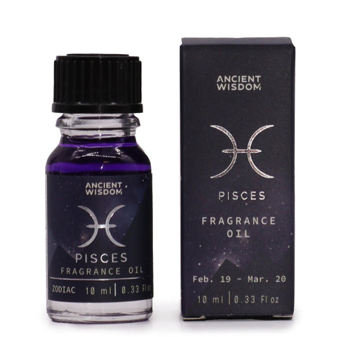 Pisces zodiac fragrance oil bottle in dark purple glass next to its star-sign gift box