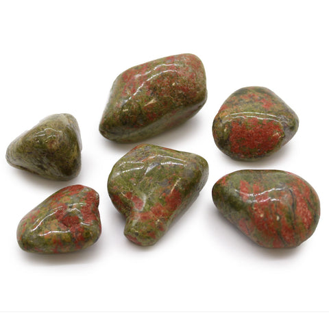 Large African Tumble Stones, Unakite, six polished green and reddish stones arranged on a white background