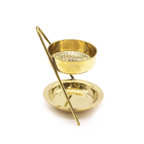 Brass incense warmer shown assembled at an angle, with its perforated upper cup visible