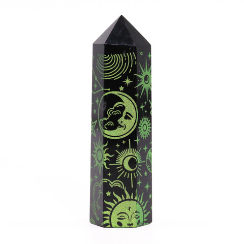 Black point with green celestial illustrations, including a crescent moon and sun, against white