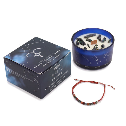 Aries candle and closed gift box standing together with the gemstone bracelet in front