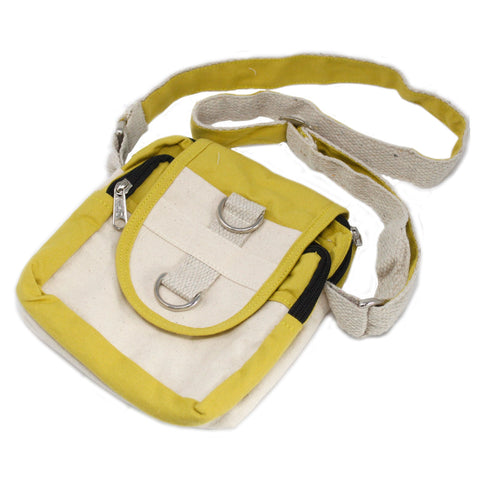Olive and cream travel bag laid flat on a white background, with its shoulder strap spread out