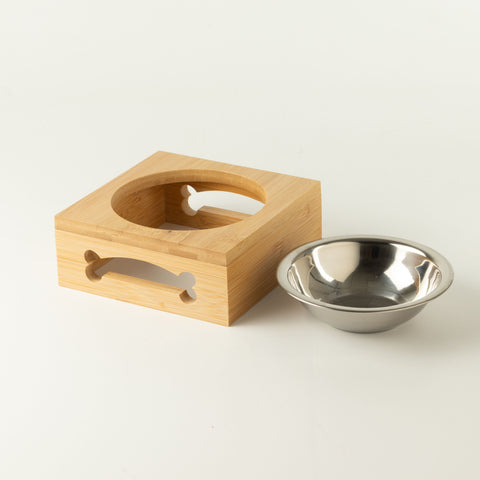 PAW pet bowl with stainless-steel dish beside wooden stand