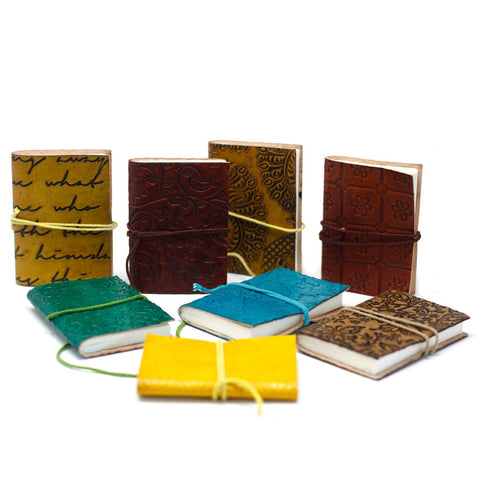Mini Assorted Leather Notebook, colourful patterned journals with wraparound cords arranged on a white background