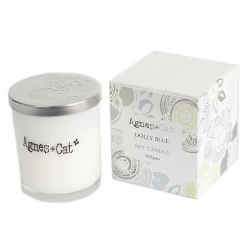 Agnes + Cat Votive Candle, Dolly Blue in a white glass jar with silver lid and patterned box