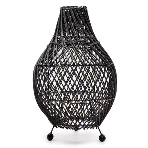 Rattan Table Lamps, Black, woven openwork lamp standing on three feet against a white background