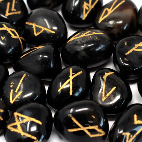 Runes Stone Set in Pouch, Black Onyx, close-up of glossy black stones with gold rune markings