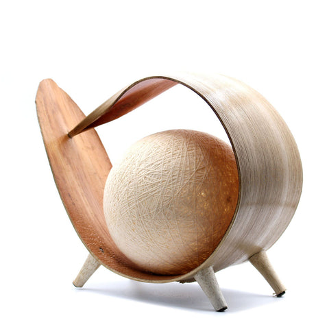Natural Coconut Lamp, Natural Loop with a pale woven globe inside a curved natural-coloured shell on three feet