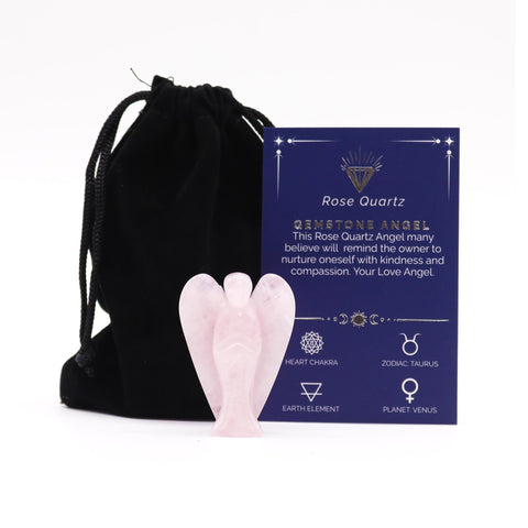 Gemstone Angel, Rose Quartz, a pale pink angel figure beside a black drawstring pouch and purple card