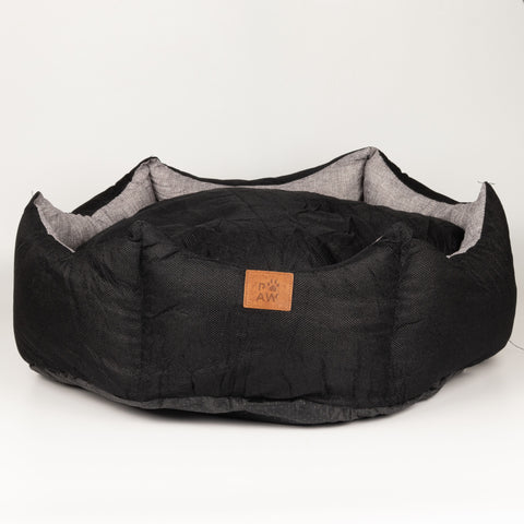 Black crown-shaped pet bed viewed from the front