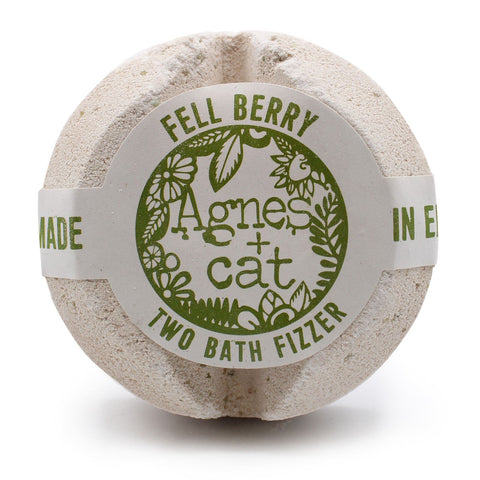 Agnes + Cat Bath Fizzer, Fellberry, round pale bath fizzer with a green and white label, front view on white
