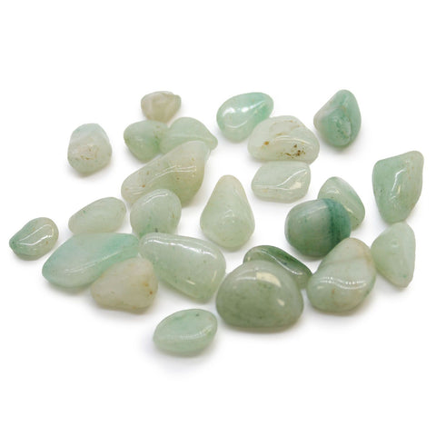 Small African Tumble Stones, Aventurine, pale green polished stones scattered on a white background