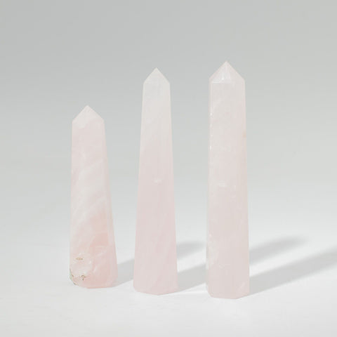 Gemstone Six Face Obelisk Point approx 11cm, Rose Quartz, three pale pink points upright on a grey background