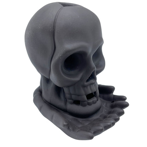 Backflow Incense Burner, Weeping Skull (with light), dark grey skull on a pooled base, shown at an angle