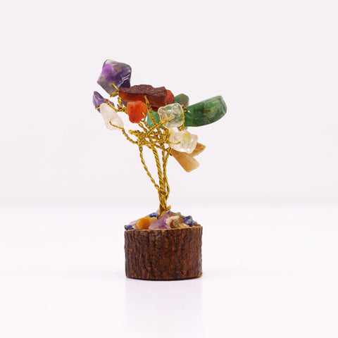 Mini gemstone tree with colourful stones and gold-coloured wire on a wood base, front view