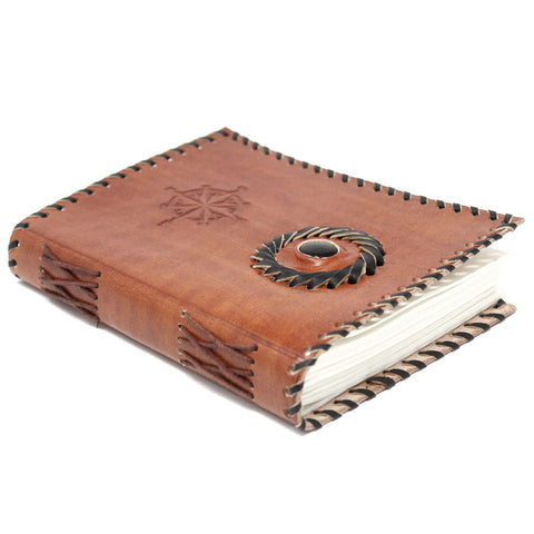 Leather Black onyx & Compas Notebook, angled view of a brown cover with compass motifs and black edging