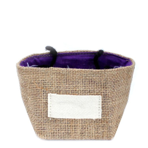 Jute cotton bag shown from the front, with its purple lining open and a blank white label