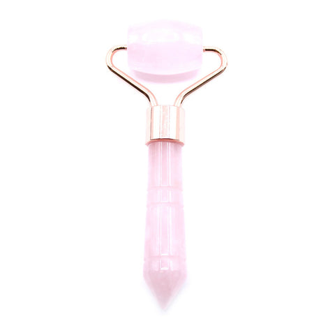 Gemstone Mini Roller, Rose Quartz, pale pink roller with rose-gold coloured metal fittings on a white background