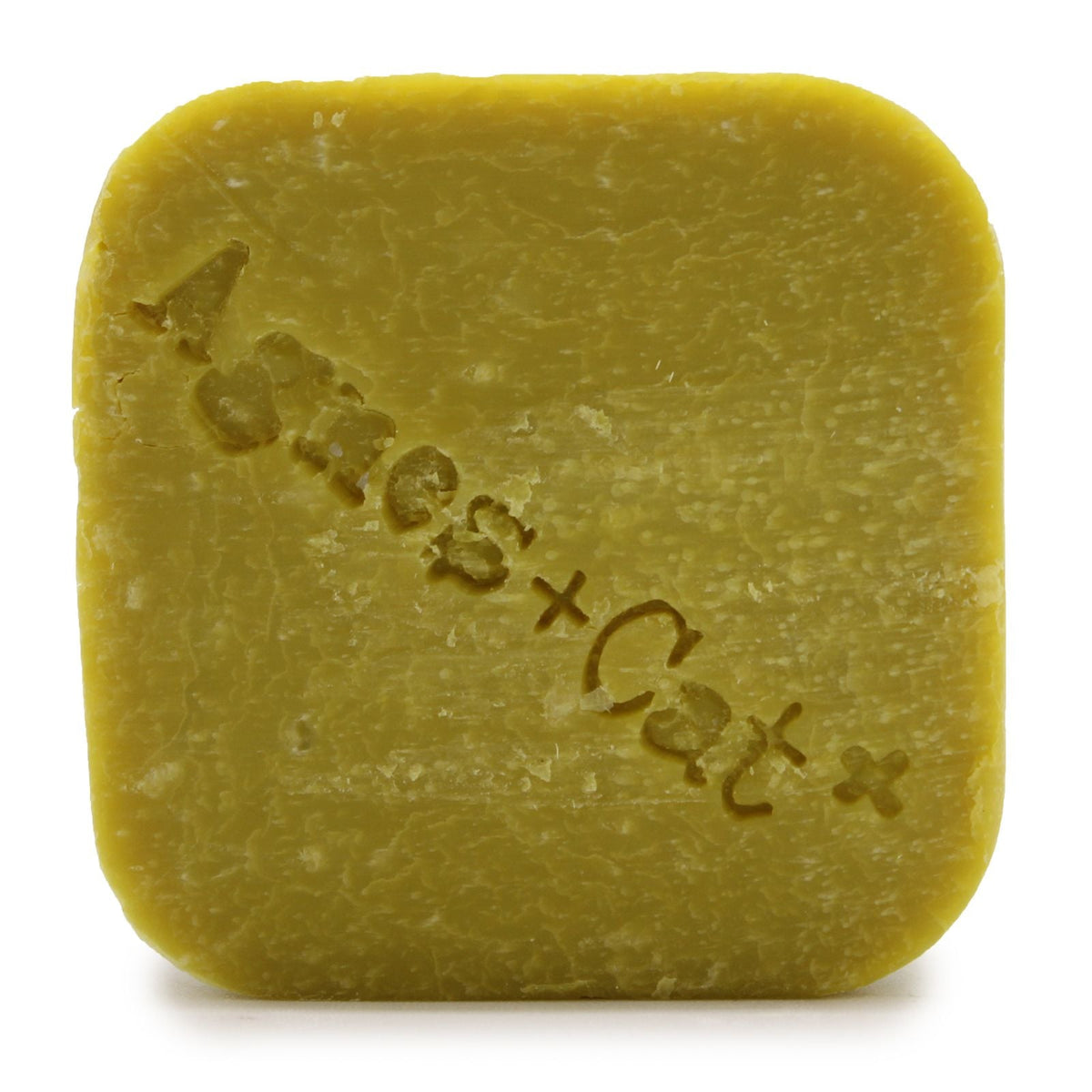 Yellow square shampoo bar with rounded corners and embossed Agnes + Cat text on a white background.