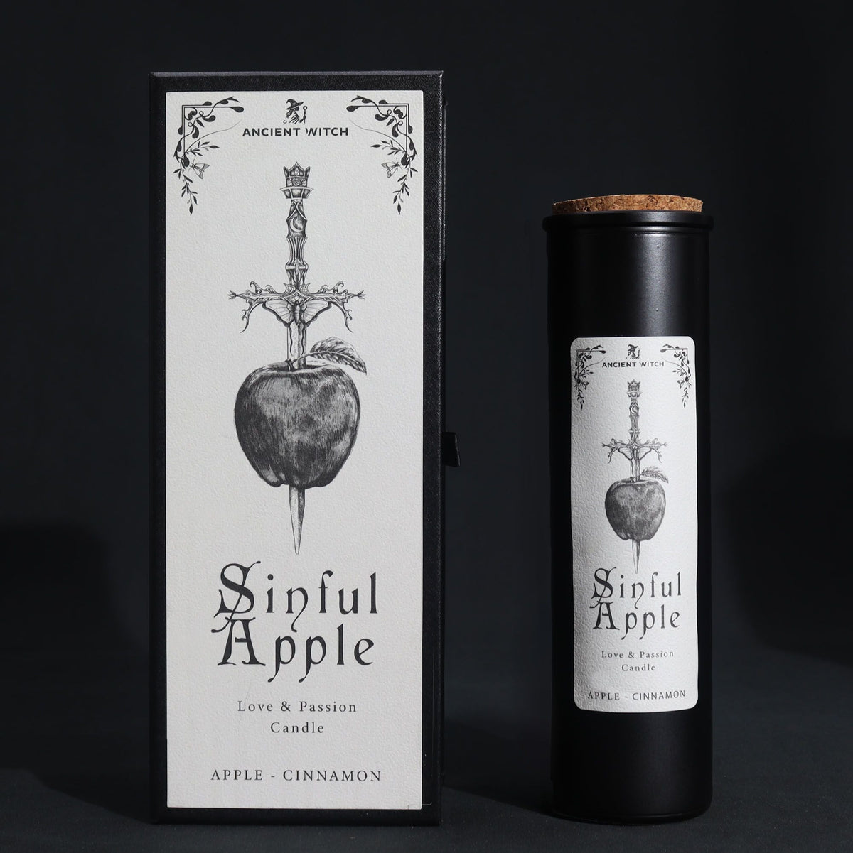 Black candle jar with a cork lid beside its matching box on a dark background.