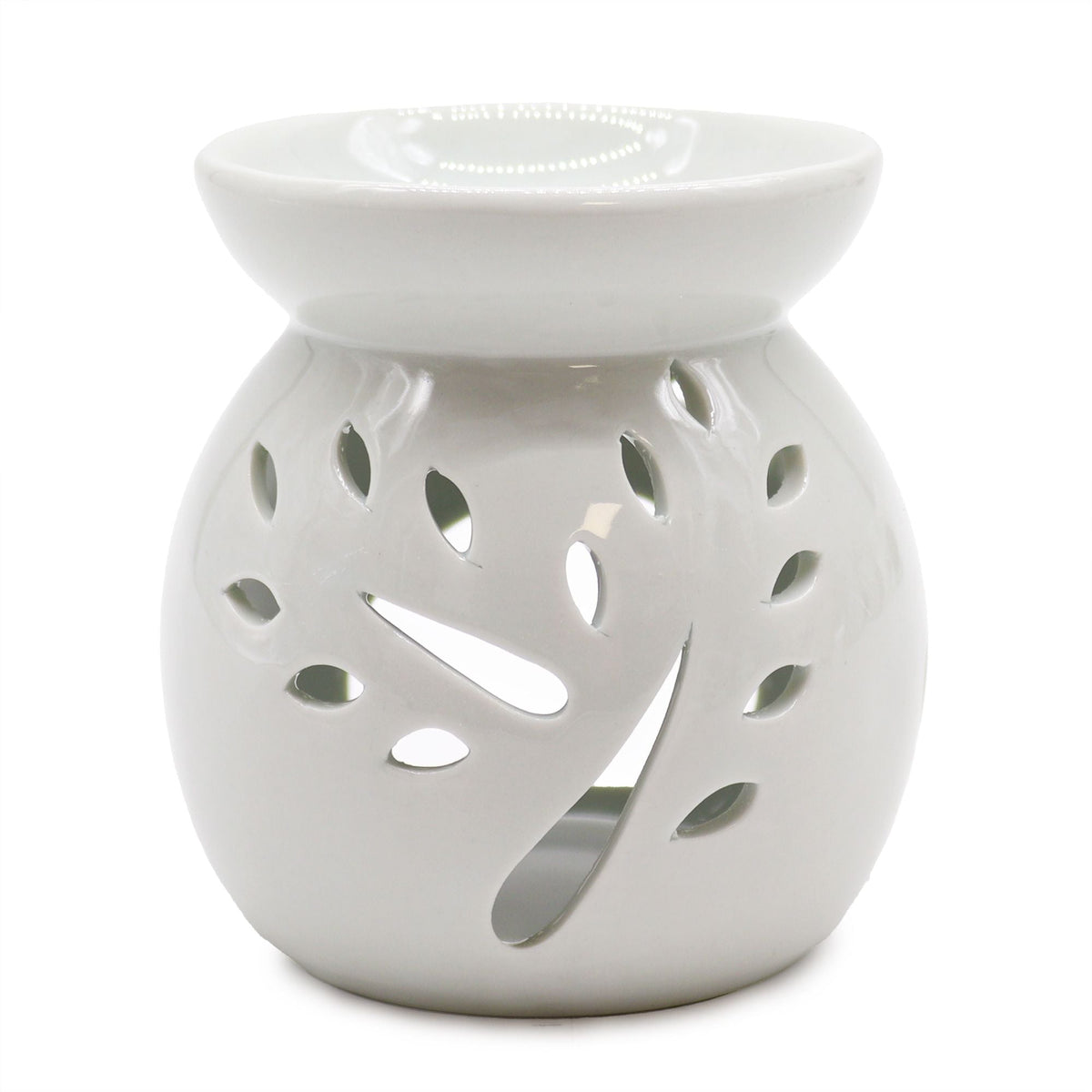 White ceramic oil burner with tree-shaped cut-outs on a plain white background.