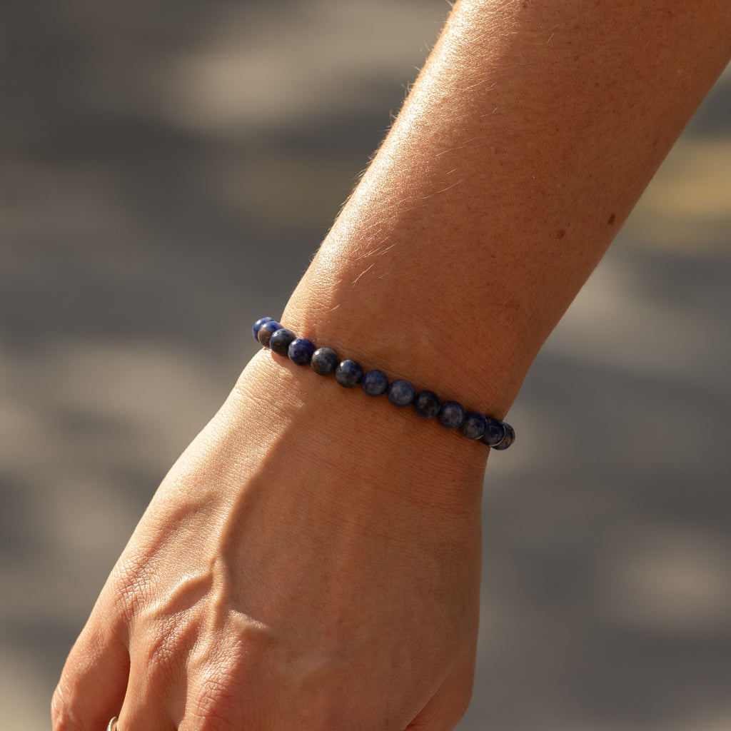 Sodalite bracelet worn on a wrist