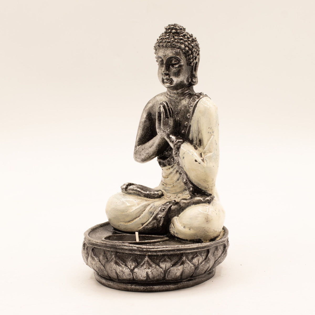 Buddha Candle Holder, White, Medium, seated figure in dark and cream tones on a patterned candle dish