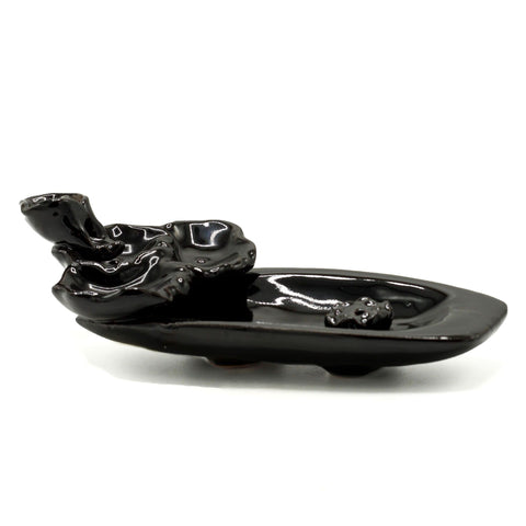 Backflow Incense Burner, Lotus Pond & Incense Stick Holder, glossy black in a low side view on white