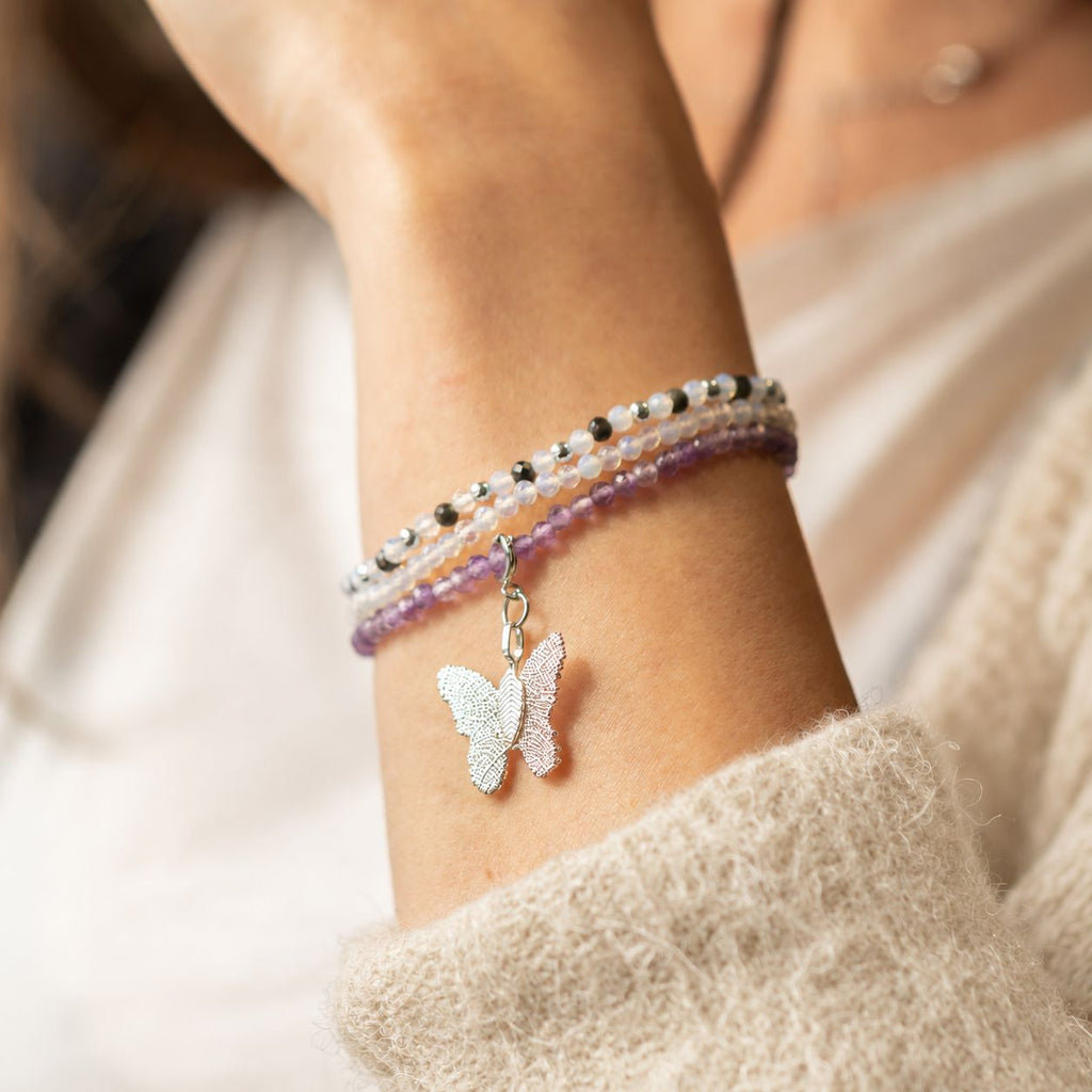 Close view of the bracelet set worn on a wrist