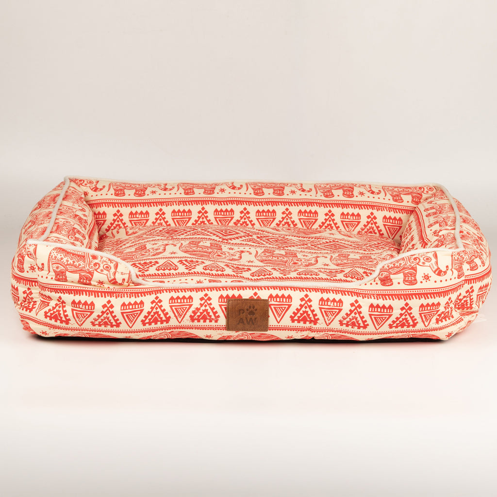 Front view of the red and cream pet bed