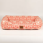 Front view of the red and cream pet bed