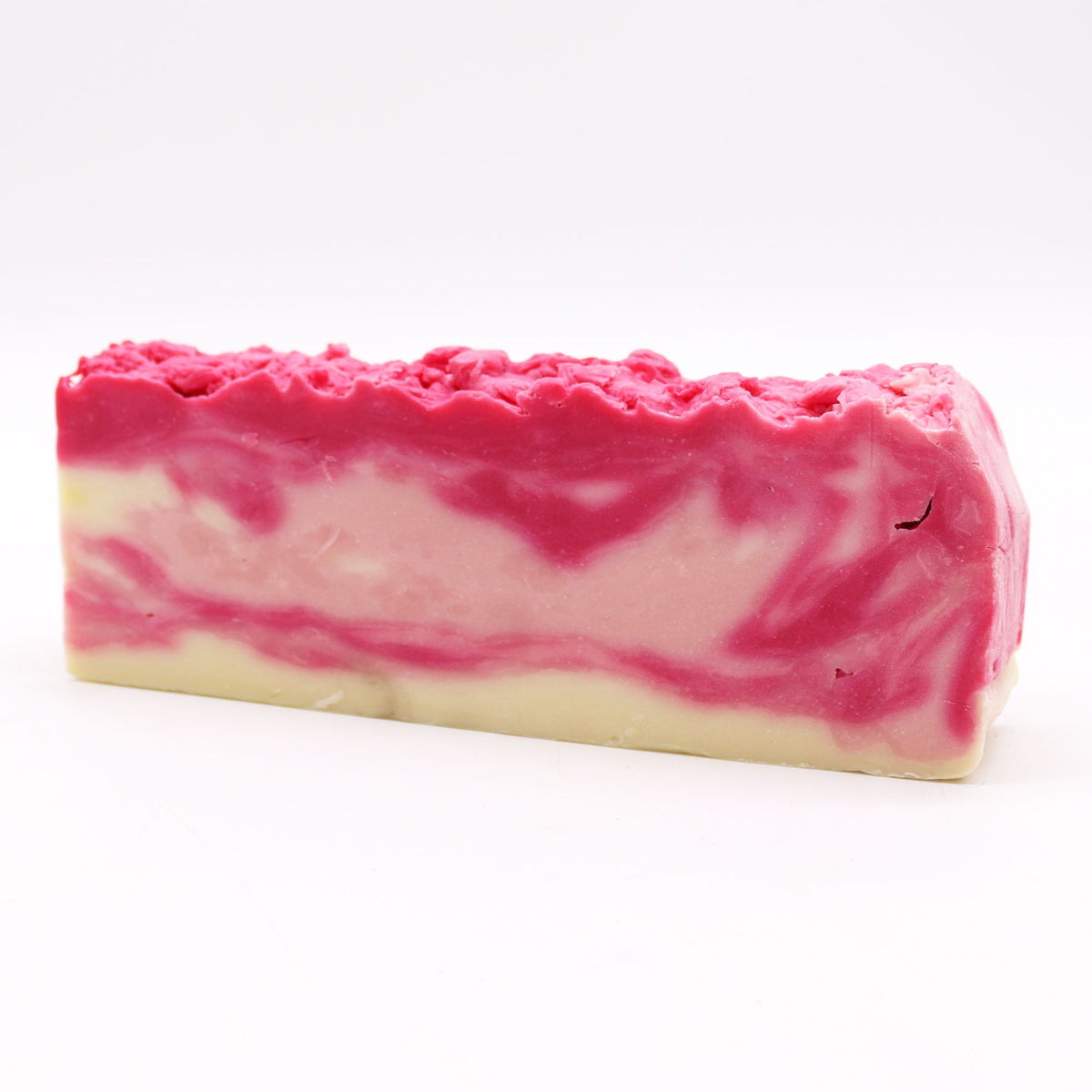 Rosehip, Olive Oil Soap Loaf with pink and cream swirls, shown whole from the front