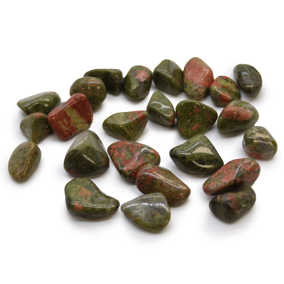 Small African Tumble Stones, Unakite, polished green and pink stones scattered on a white background