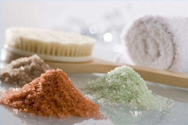 Bath potion salts in pale green and pink piles