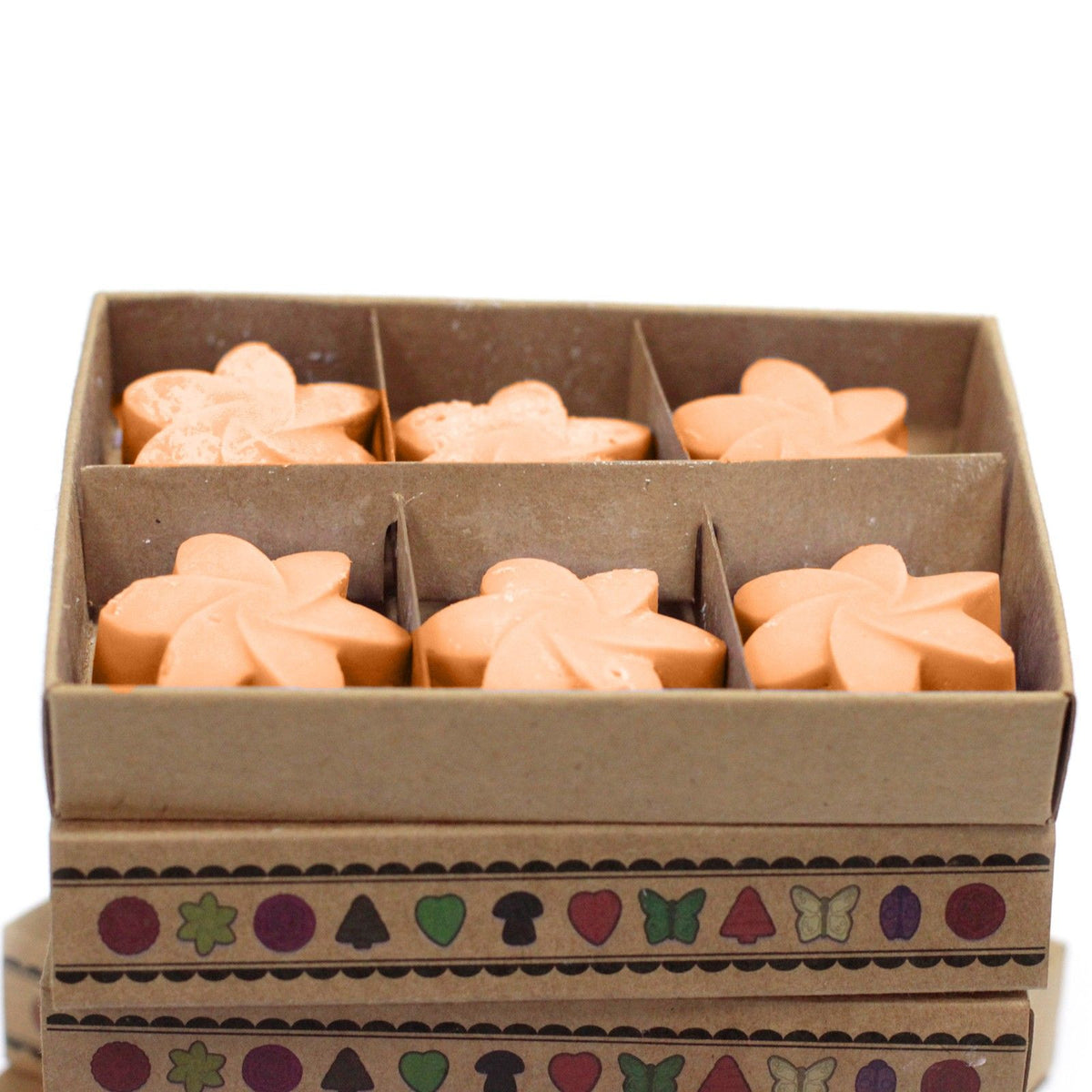 Mango Fruits wax melts arranged in six compartments inside an open kraft box, viewed from the front