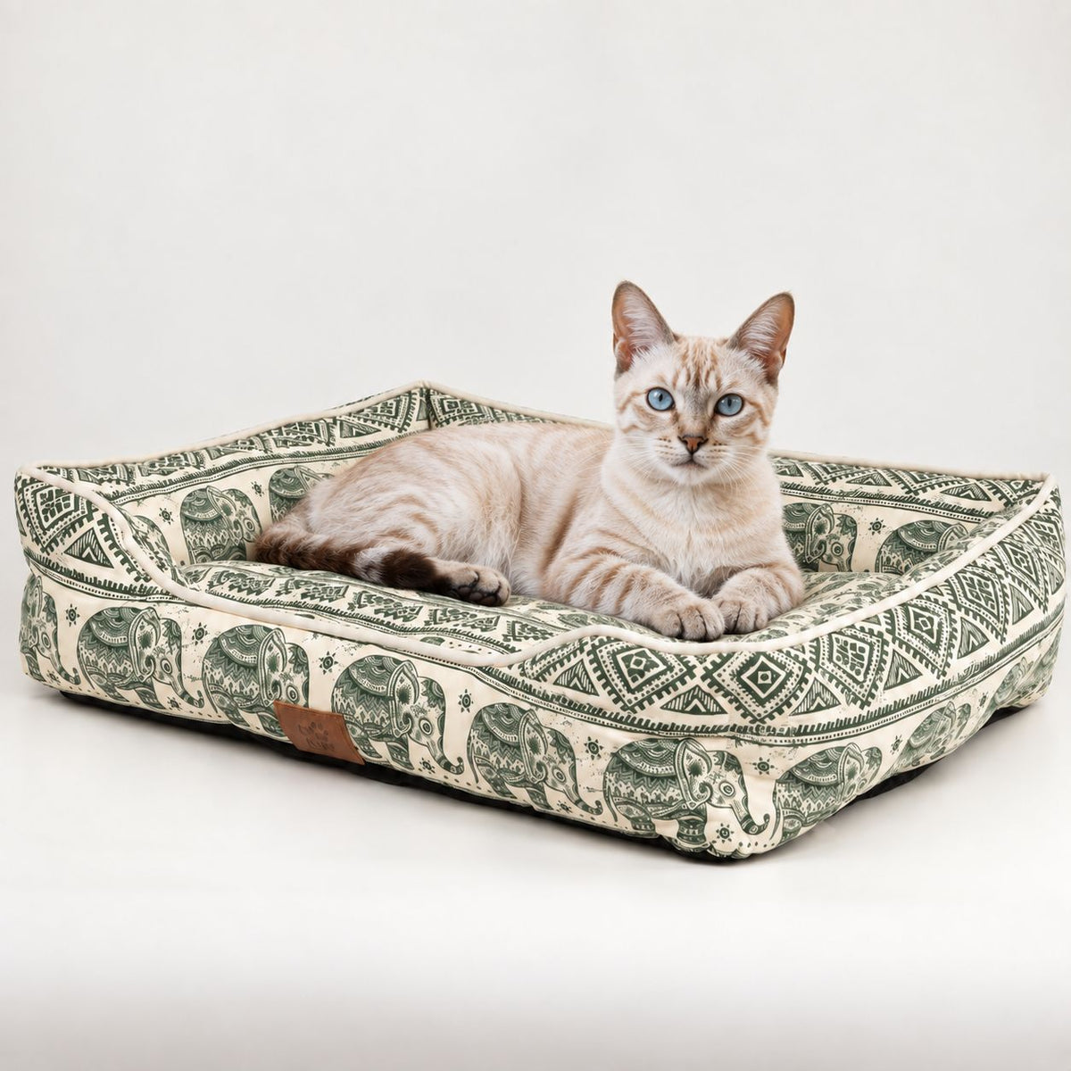 Green Lucky Elephant pet bed with a cat resting inside