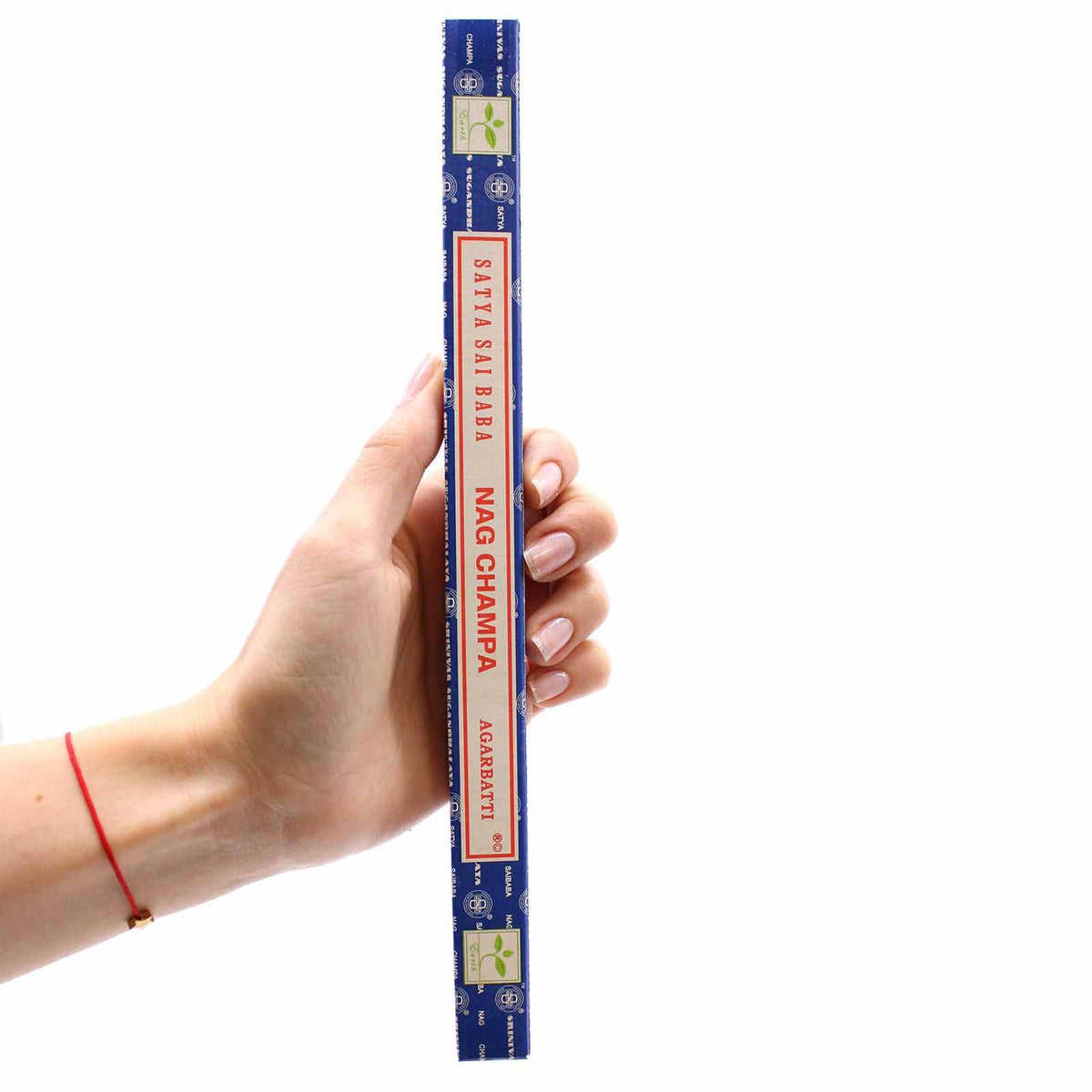 Satya Nagchampa Incense 10 Gms, blue incense box held upright in a person's hand