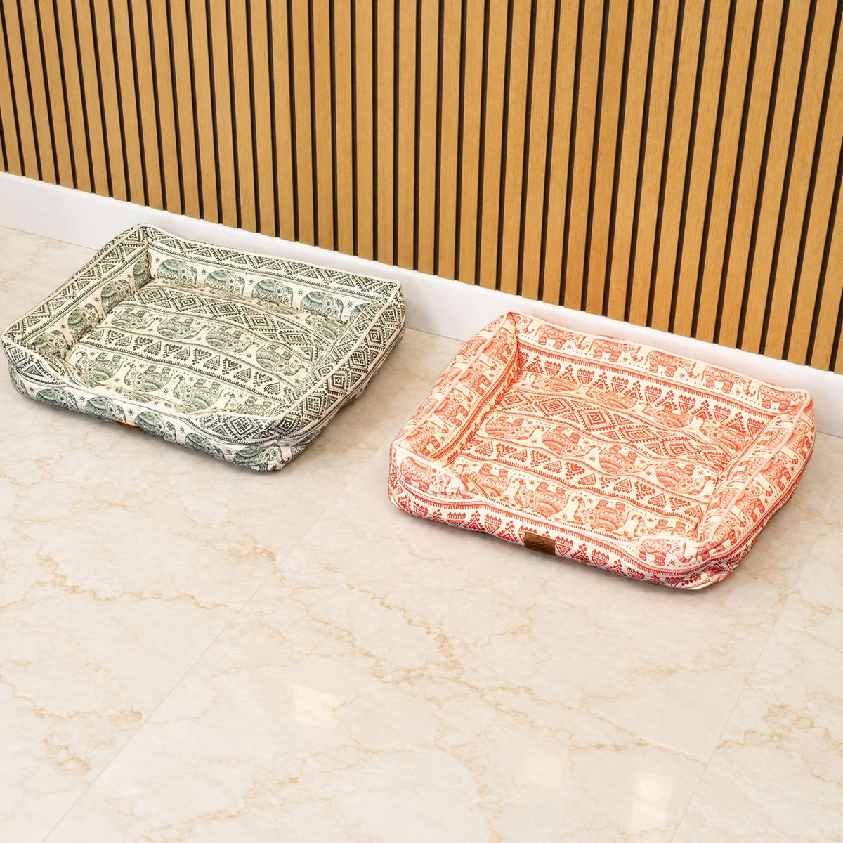 Green and orange patterned pet beds shown side by side