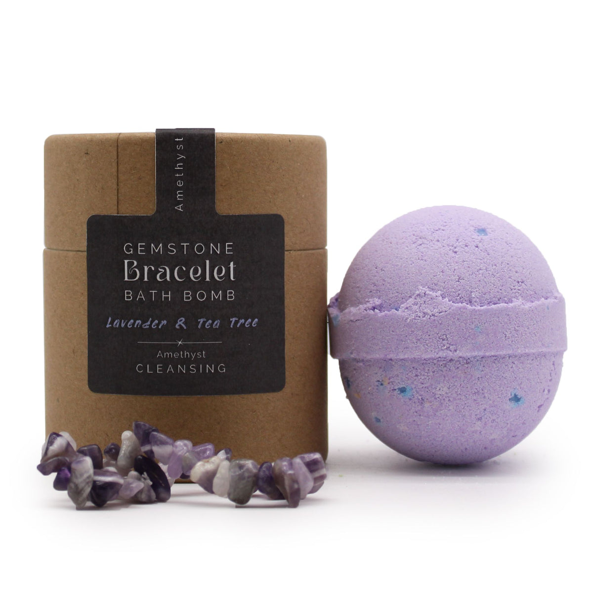 Front view of the labelled brown tube, purple bath bomb and stone bracelet on white