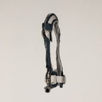 Side view of the PAW harness with its paw charm and adjustable straps