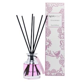 140ml Reed Diffuser, Tea & Roses, pink liquid in a clear bottle with black reeds beside its floral box
