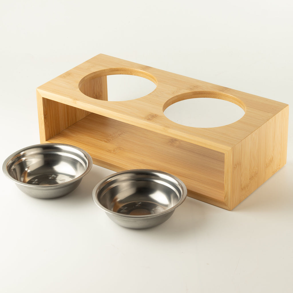 PAW double pet bowls with two stainless-steel bowls beside the wooden stand