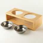 PAW double pet bowls with two stainless-steel bowls beside the wooden stand