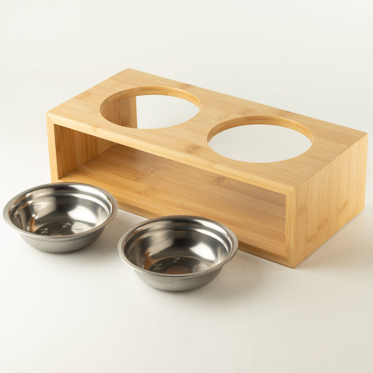 PAW double pet bowls with two stainless-steel bowls beside the wooden stand