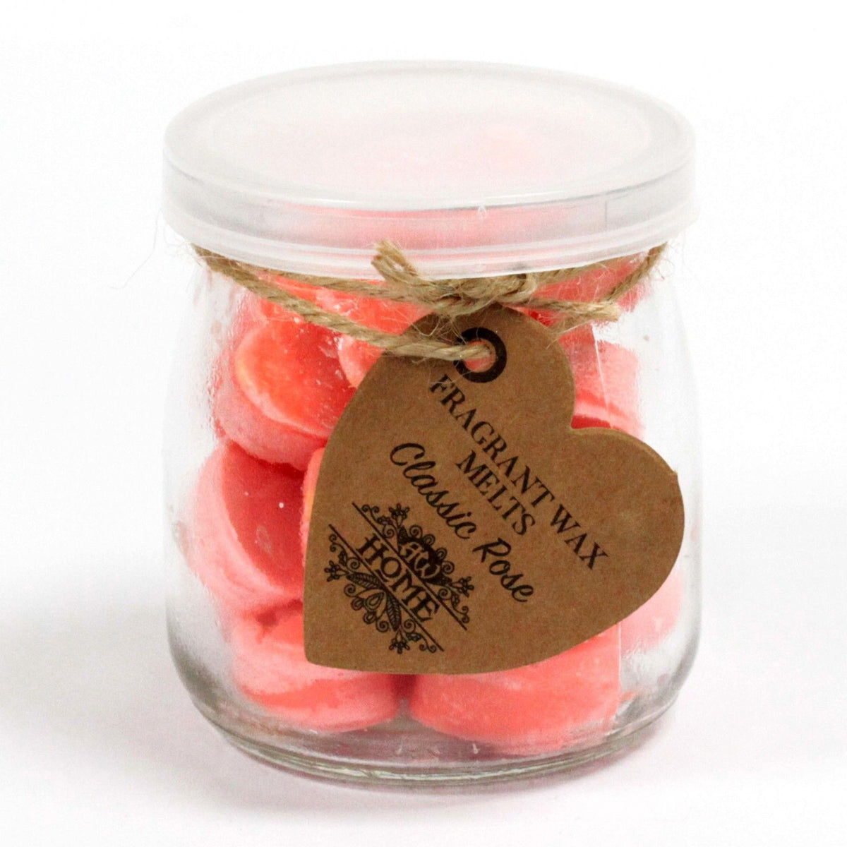 Close-up of the lidded Classic Rose jar filled with pink wax melts and a twine-tied heart label