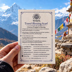 Printed Travel Blessing Scarf card held up against a mountain view