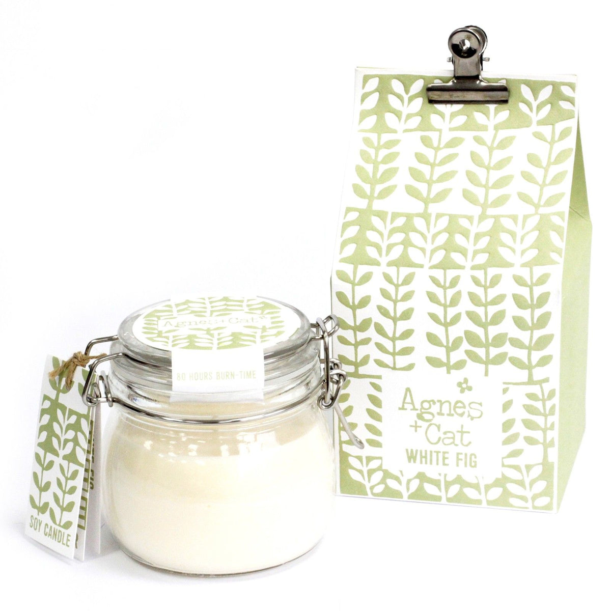 Agnes + Cat Kilner Jar Candle, White Fig in a clear glass jar beside its green and white tag and packaging
