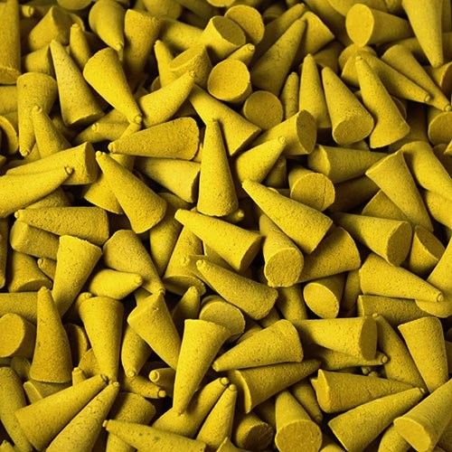Bulk Incense Cones, Lemon, a close-up of loose yellow cones piled together